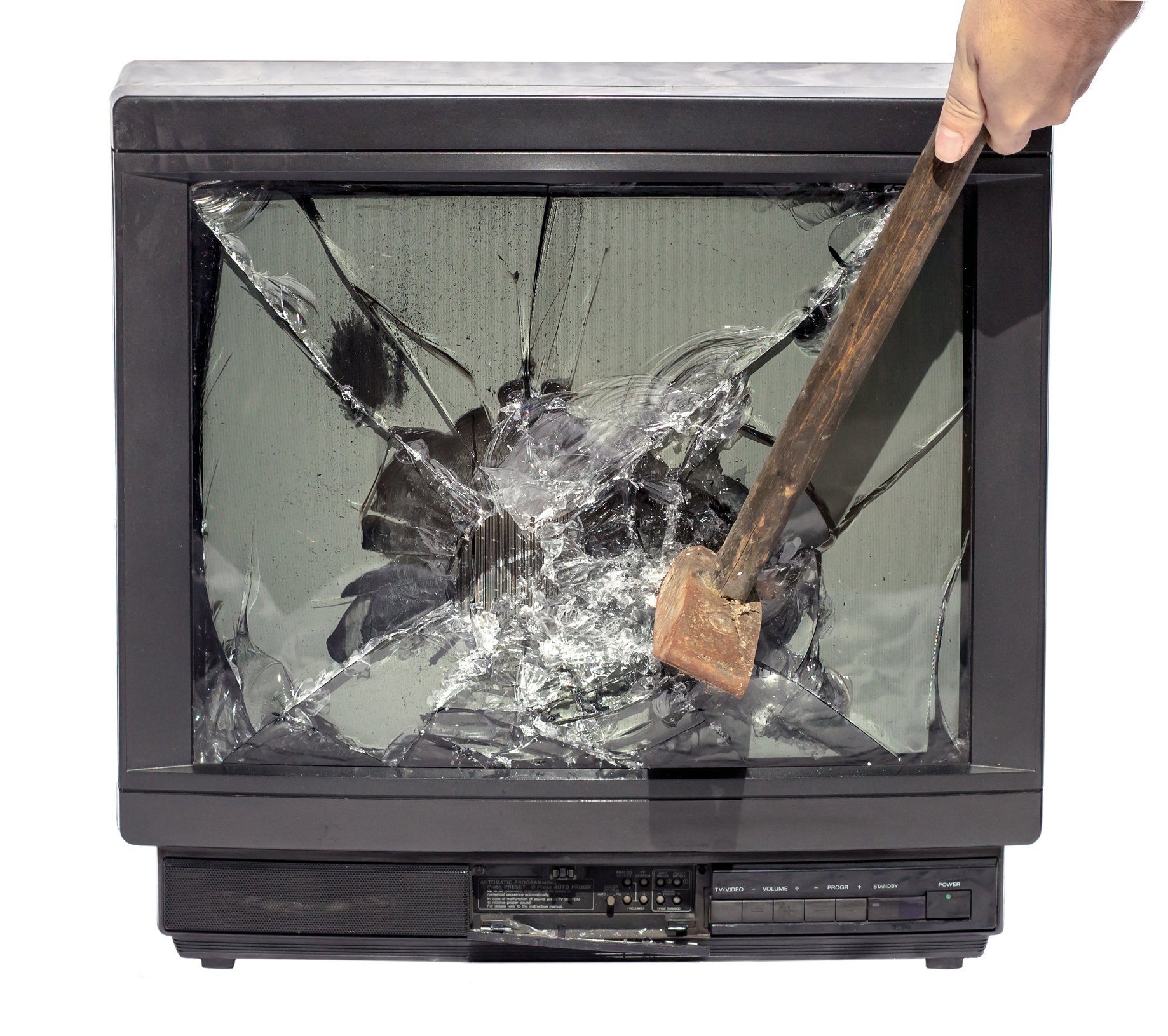Man smashing a television set with a hammer