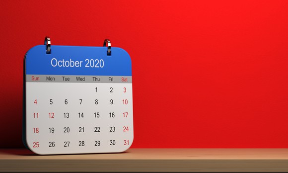 October 2020 calendar with a red wall in the background. 