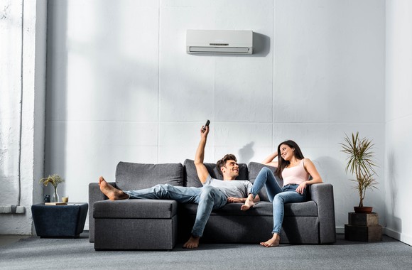 A young couple enjoying air-conditioning. 