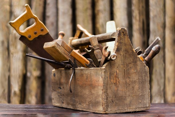Old wooden toolbox, full of tools