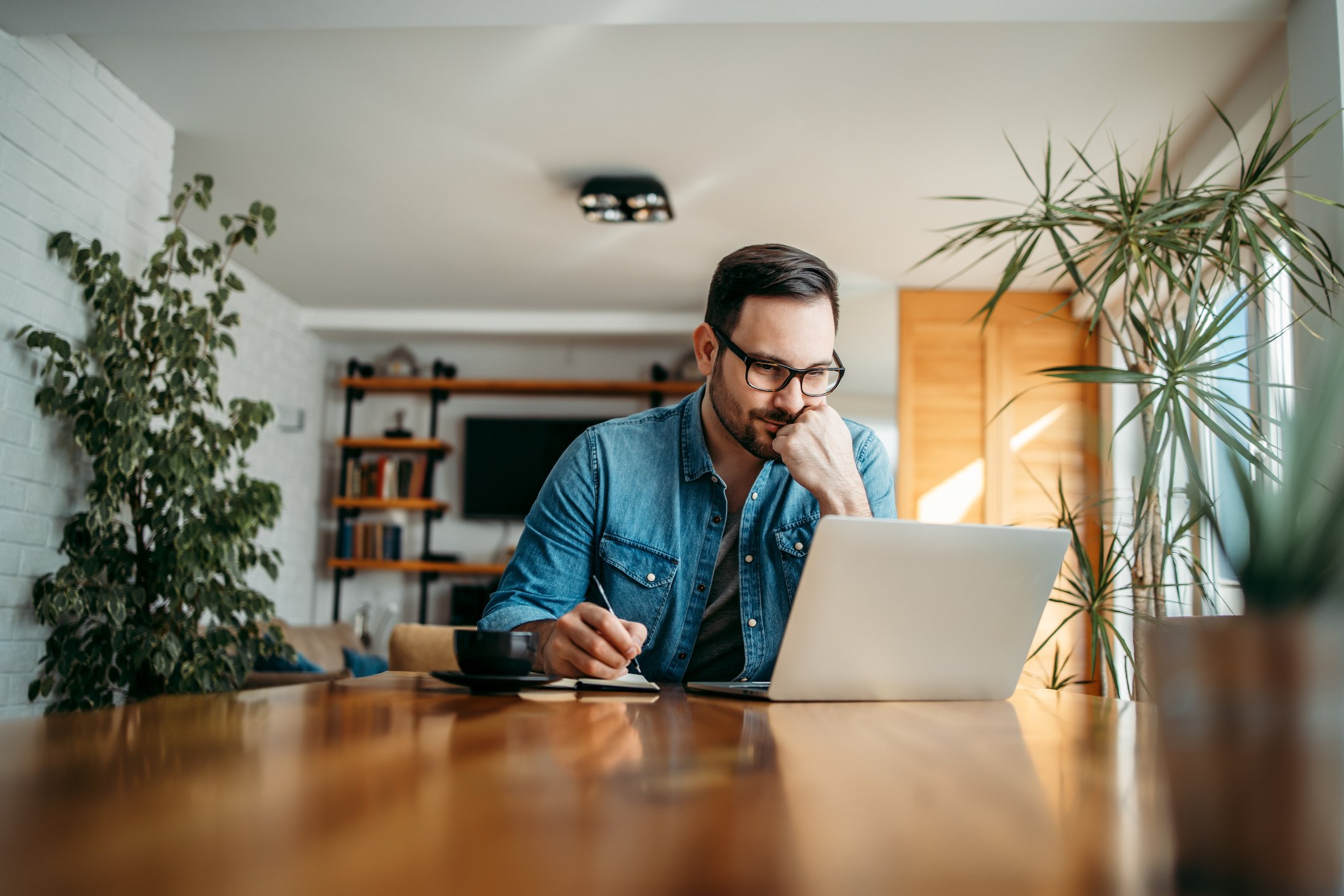 Man working at a computer.