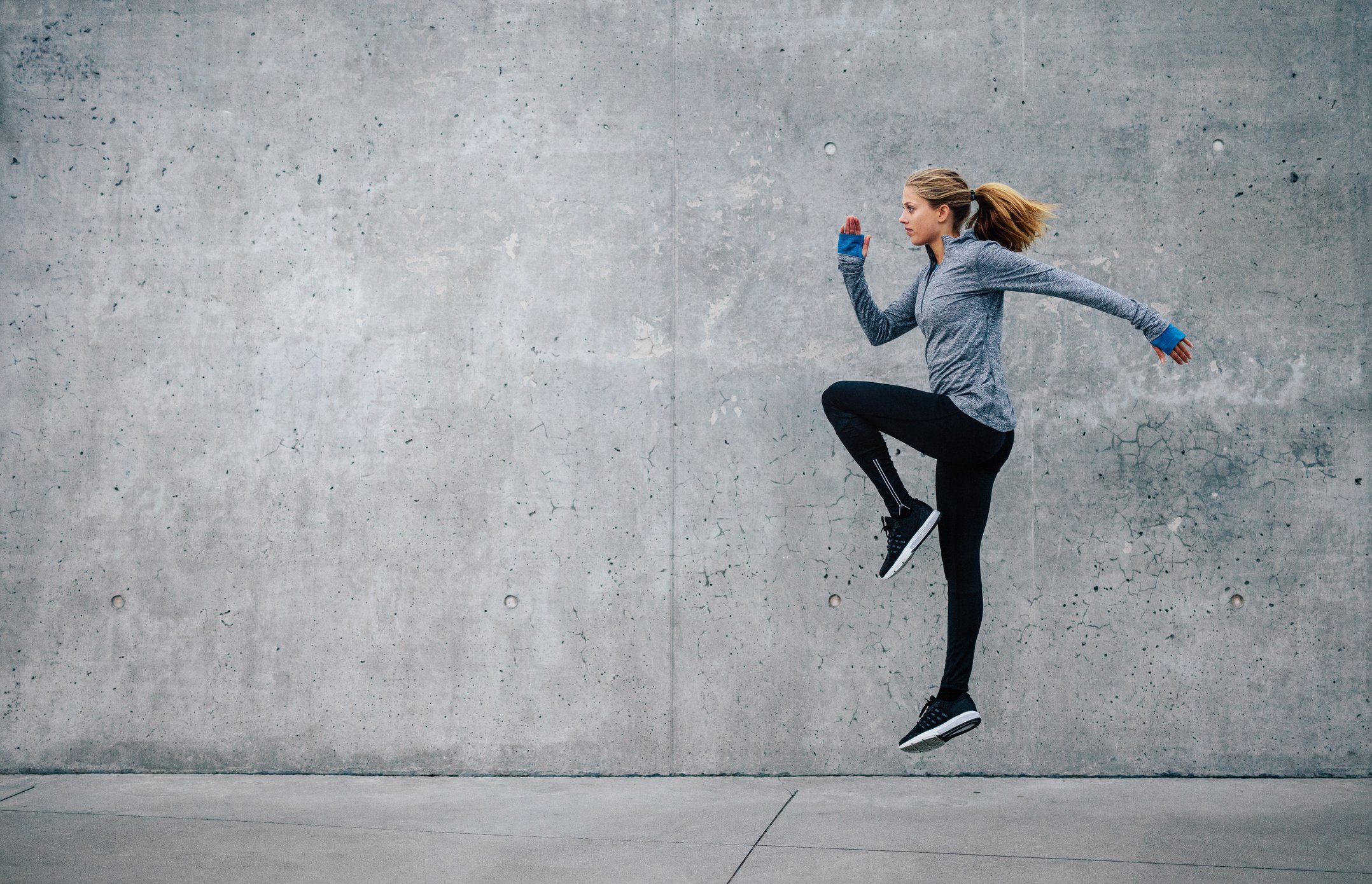 Woman doing warmup in athletic attire