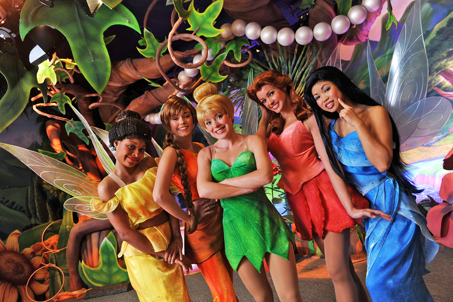 Tinkerbell and Tinkerbell fairies posing at Disney World.