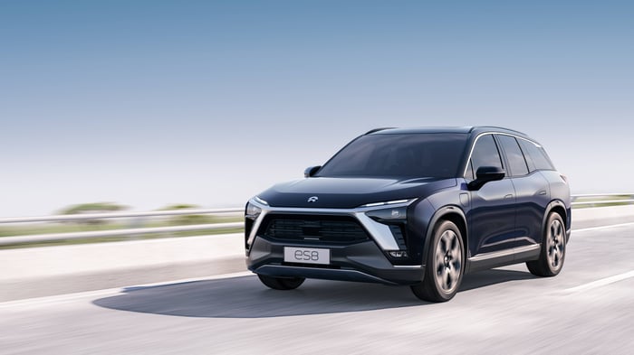 NIO vehicle driving down the road. 