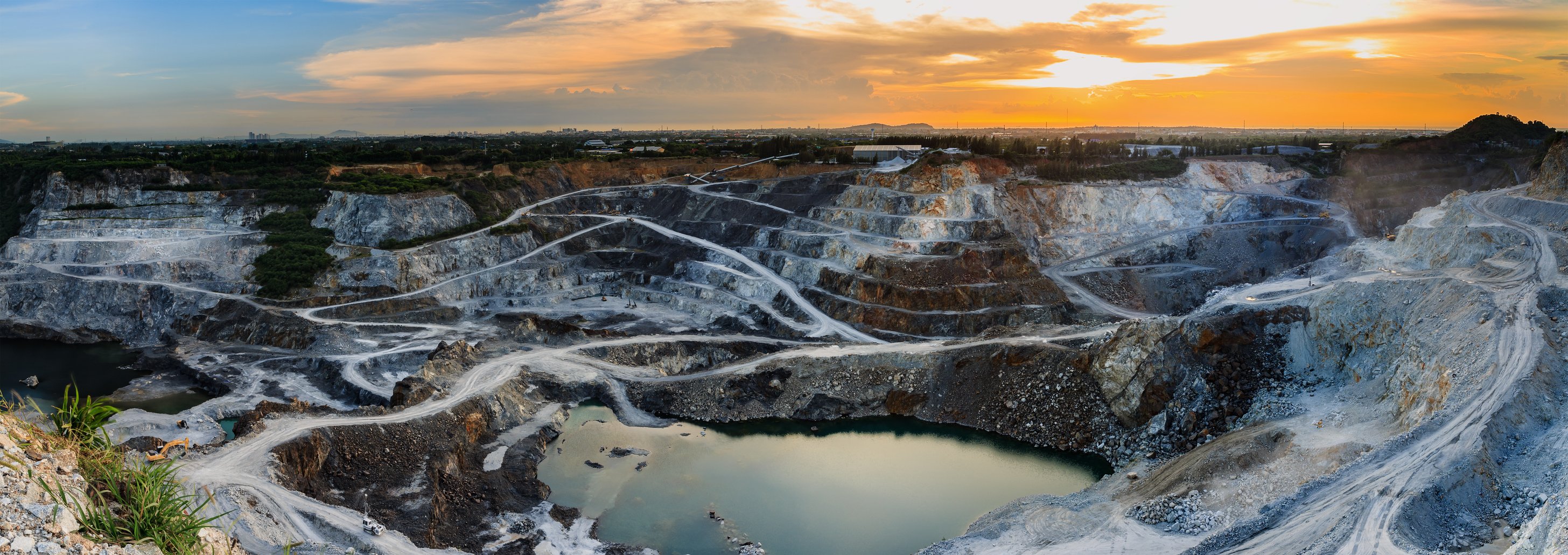 An open pit mine at dusk