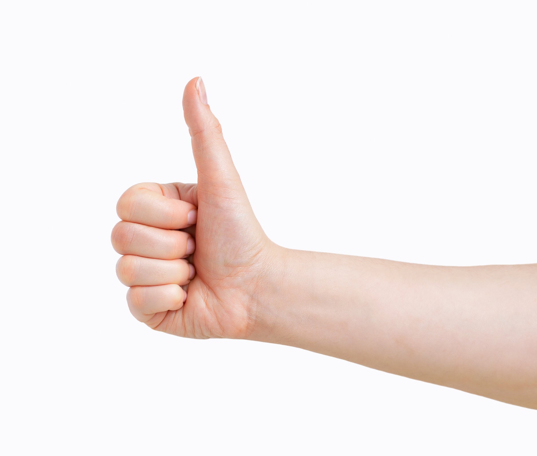 A hand points its thumb up against a white background.
