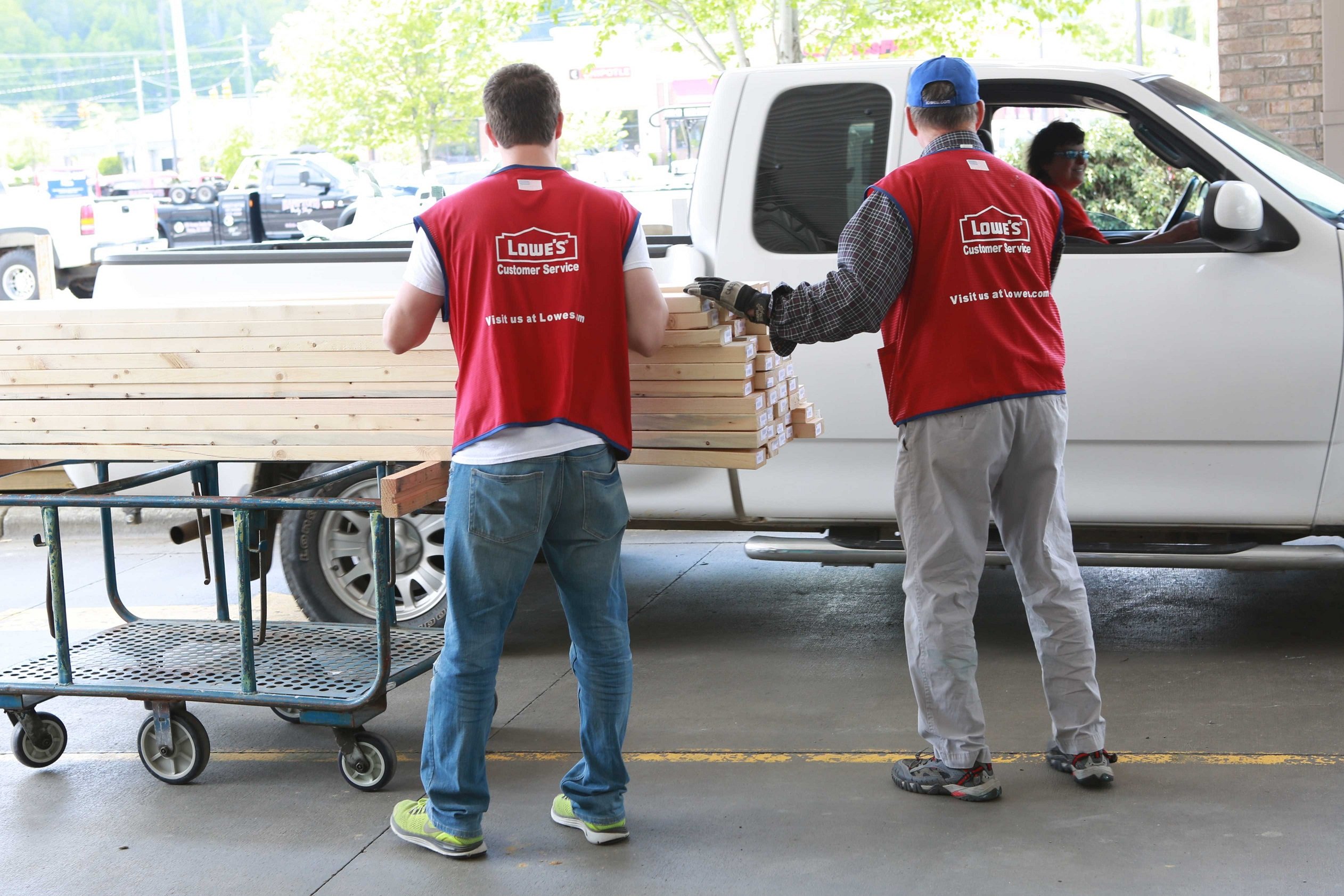 Lowe's workers with a customer.
