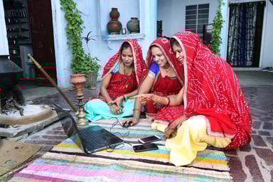 Indian tradtional women working on laptop