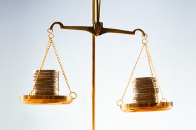 Getty - coins scale balance weighing compare money