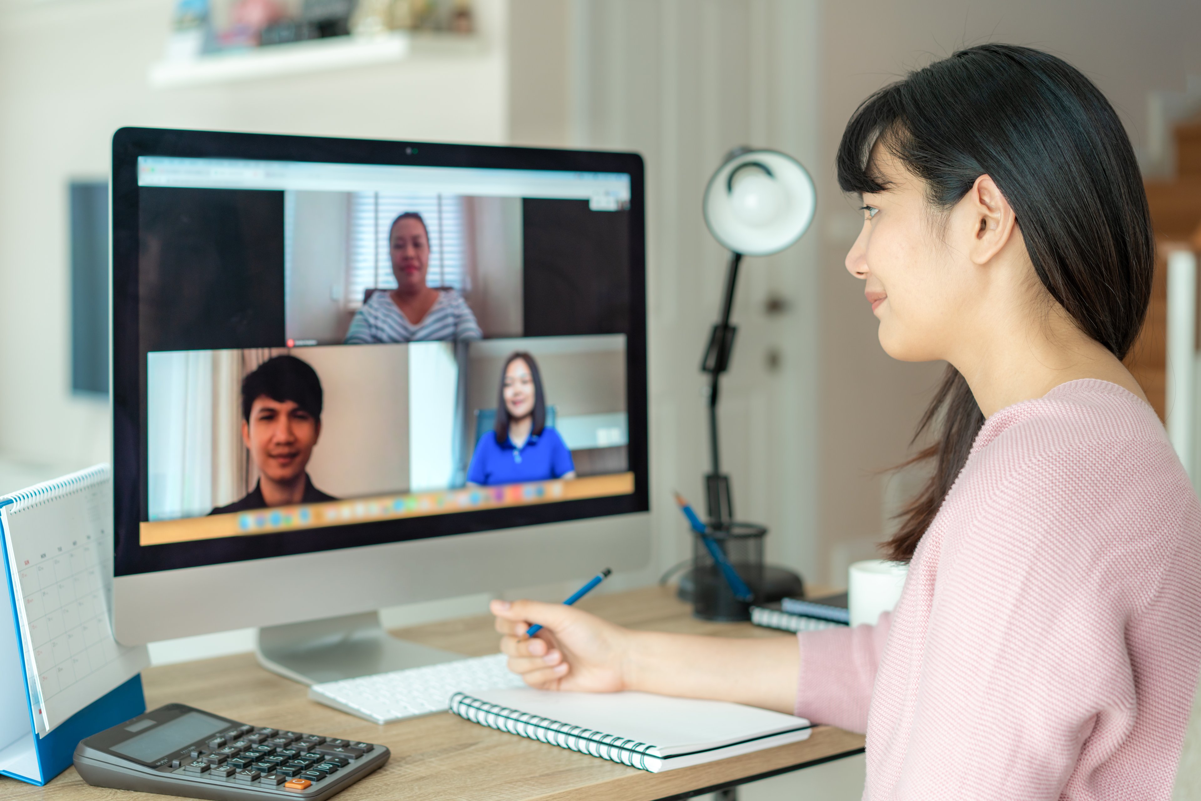 Woman video conferencing with her peers.