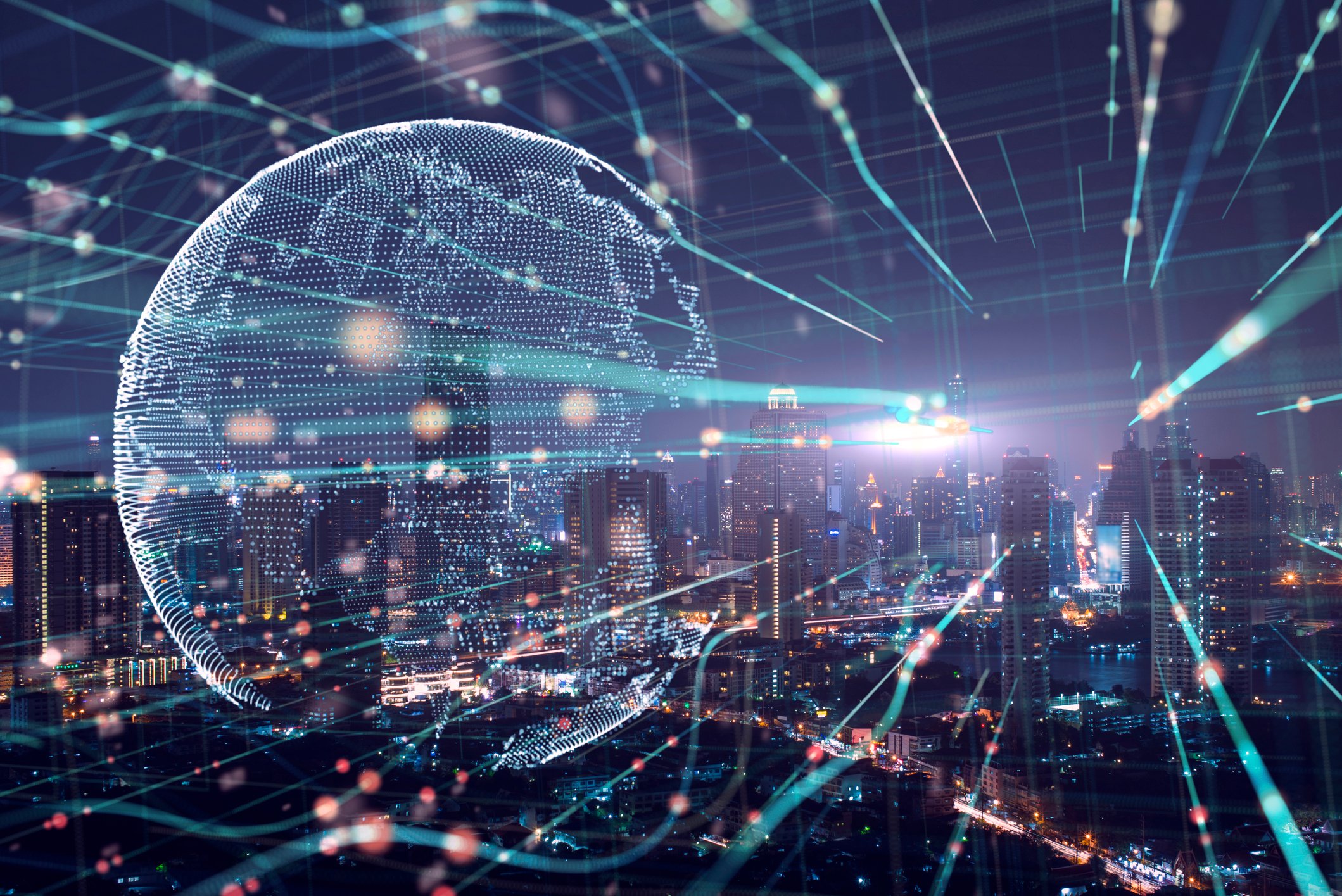 A digital global cascaded across a city landscape.