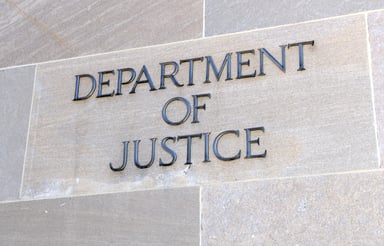 Department of Justice sign on building