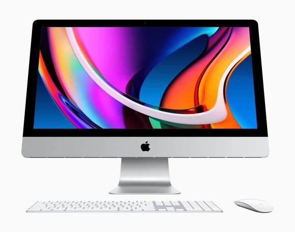 An Apple iMac displays a colorful screen.