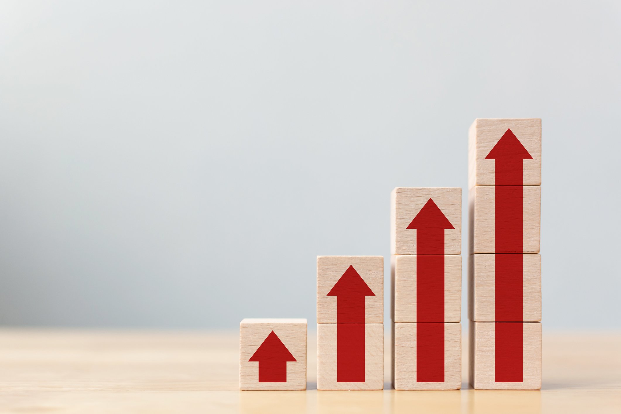 Blocks with arrows showing growth like a chart. 