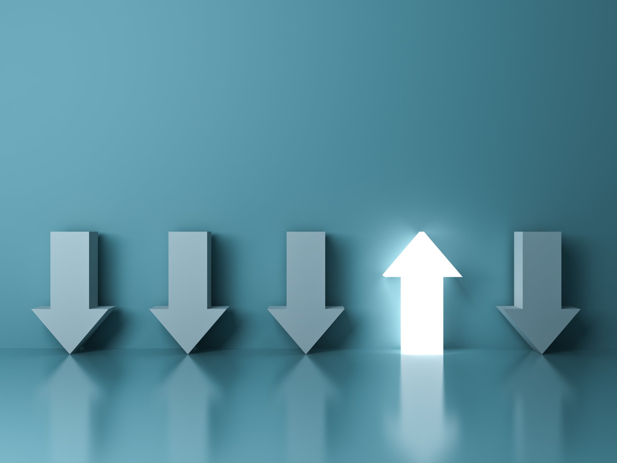 Bright arrow pointing up with four other arrows pointing down