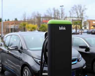 A Blink charging station in a parking lot