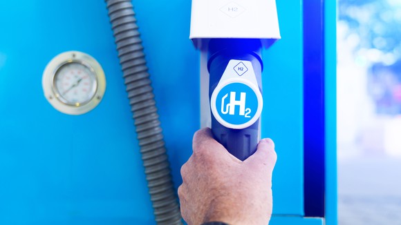 The symbol for hydrogen on a fuel dispenser.
