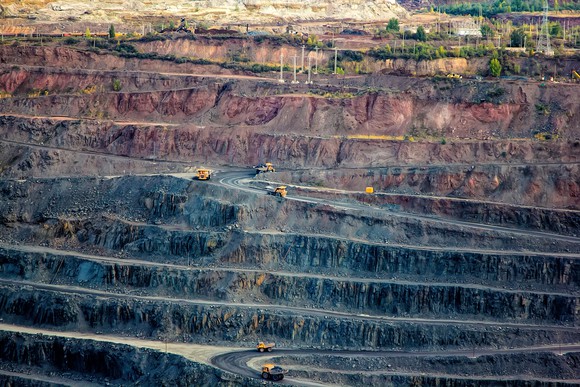 Heavy trucks in an open pit mine