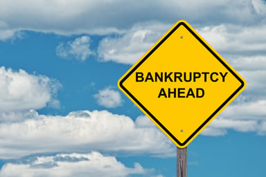 A sign that says bankruptcy ahead.