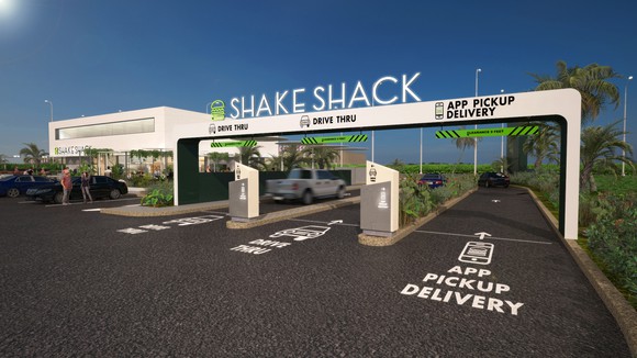 An artist rendering of a future Shake Shack location featuring a drive-thru.