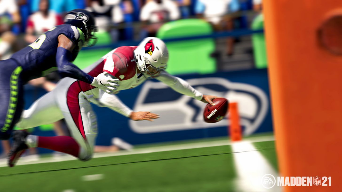 A football player tackling another player during gameplay in Madden NFL 21 video game.