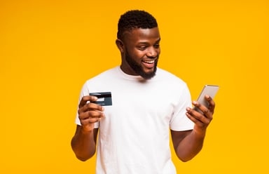 Man with phone and credit card