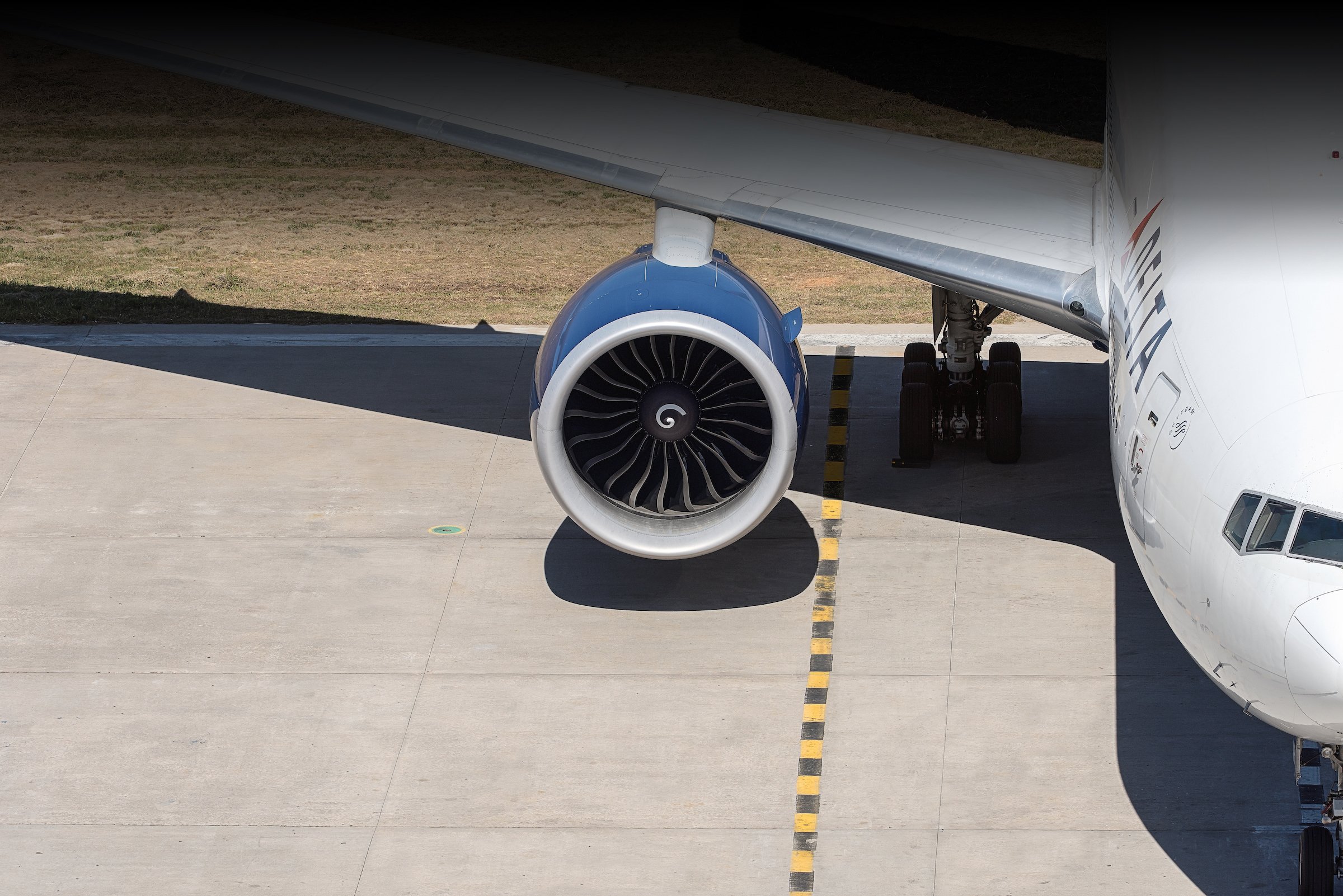 A Delta 777 on the tarmac.