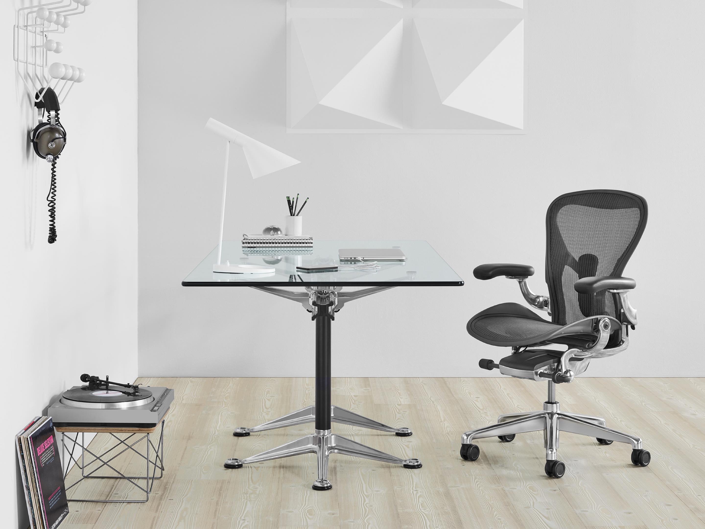 The Herman Miller Aeron chair next to desk.