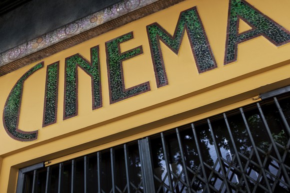 Cinema sign above a closed cinema. 