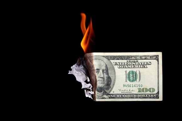 Dollar bill on fire