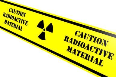 Yellow tape reads CAUTION RADIOACTIVE MATERIAL