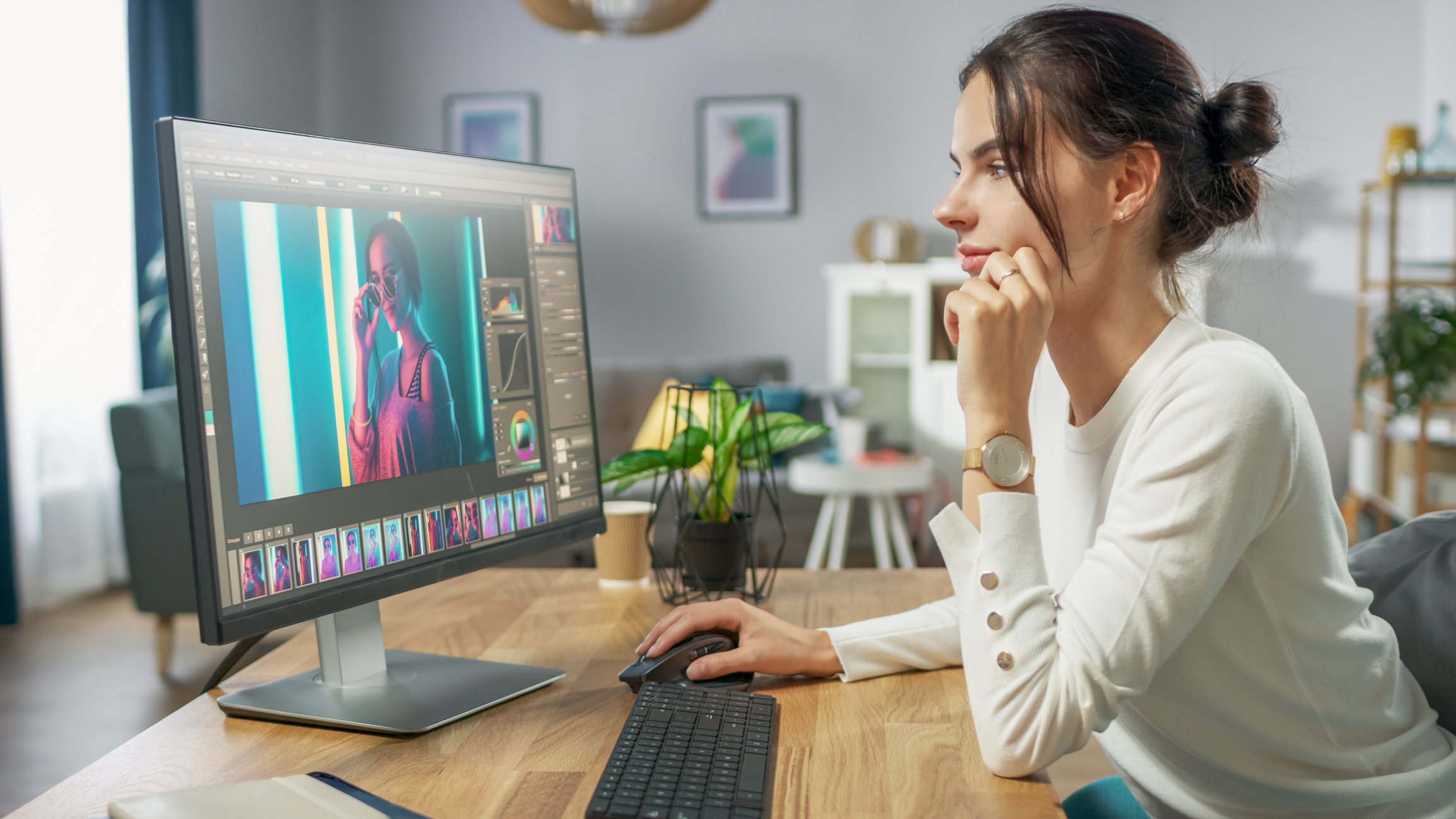 female editing a photo at her computer