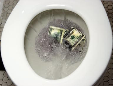 Flushing $100 bills down the toilet