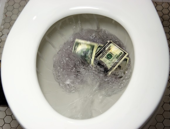 Flushing $100 bills down the toilet.