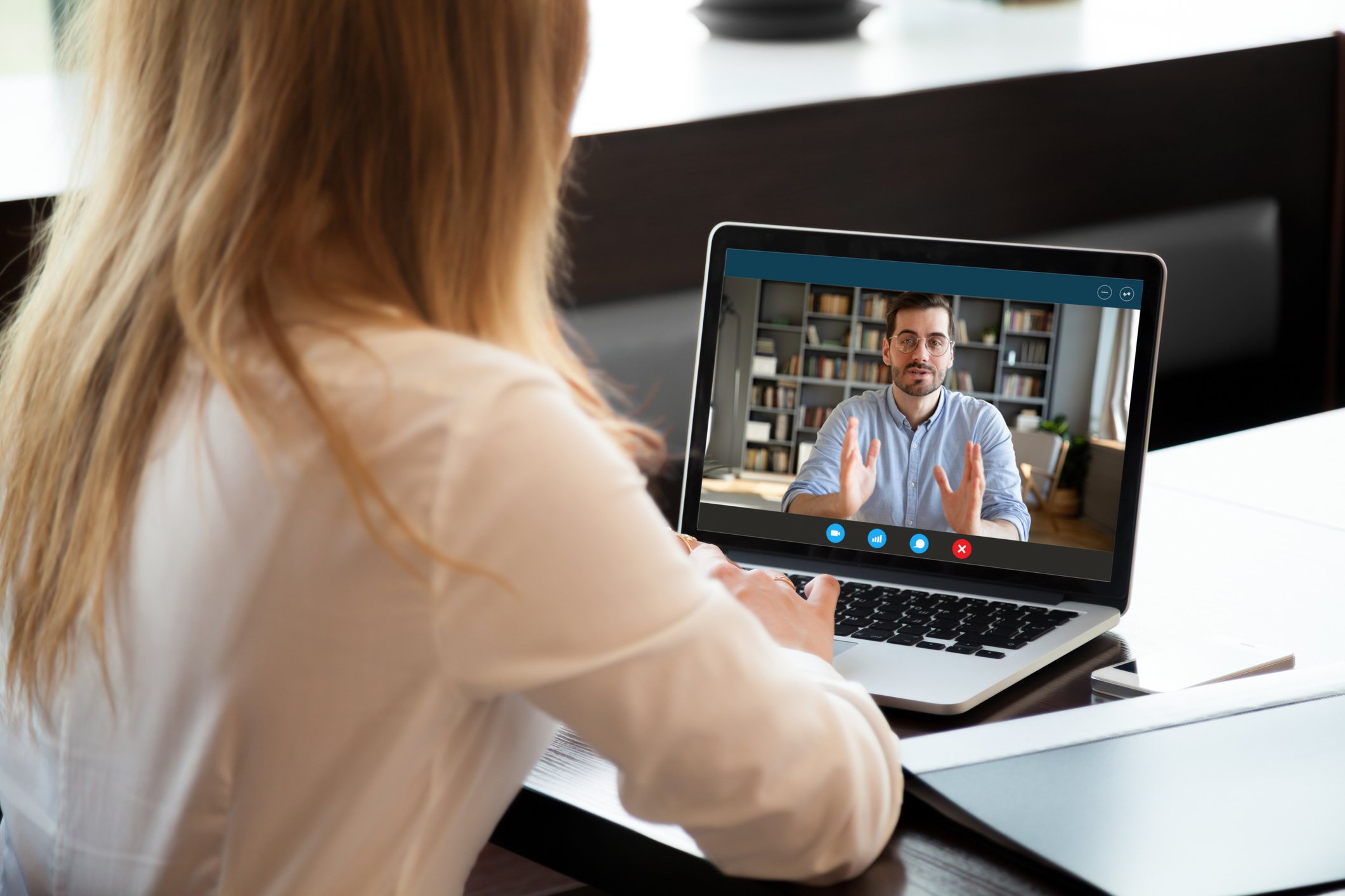 A woman using a computer.