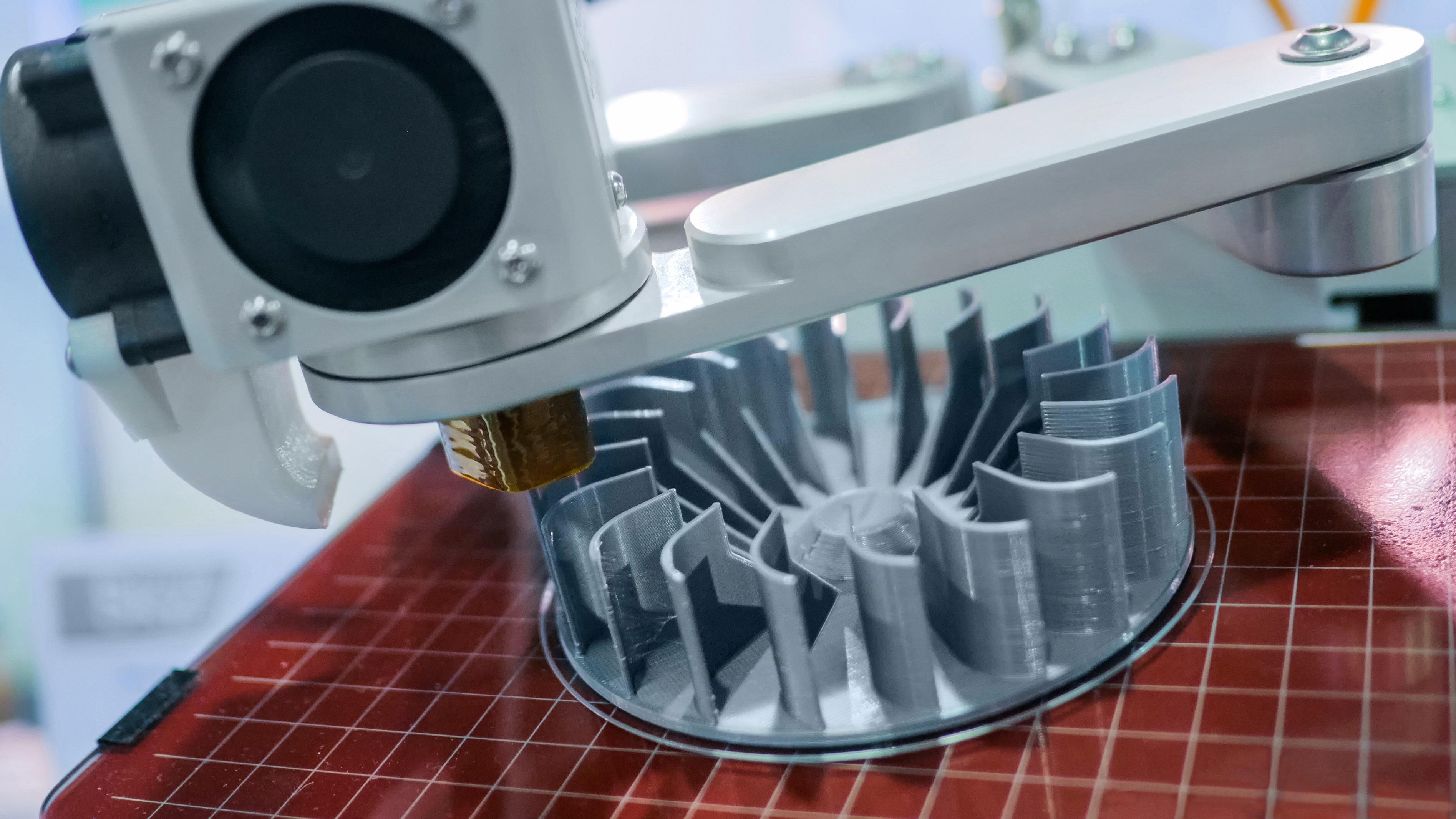 A 3D printer in the process of printing a complicated turbine part.