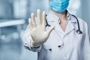 Doctor with mask and hand up