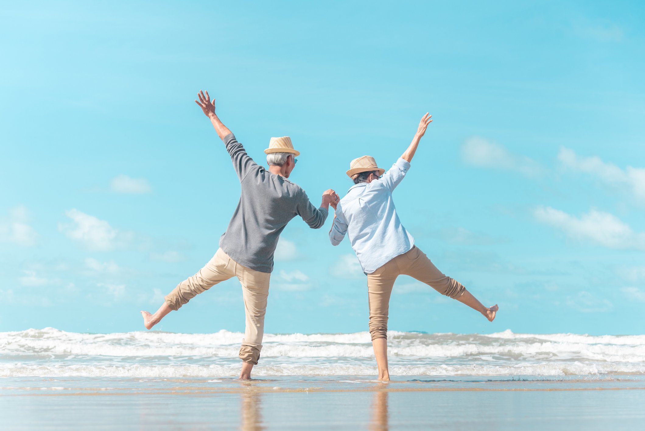 Older couple dancing on the beach