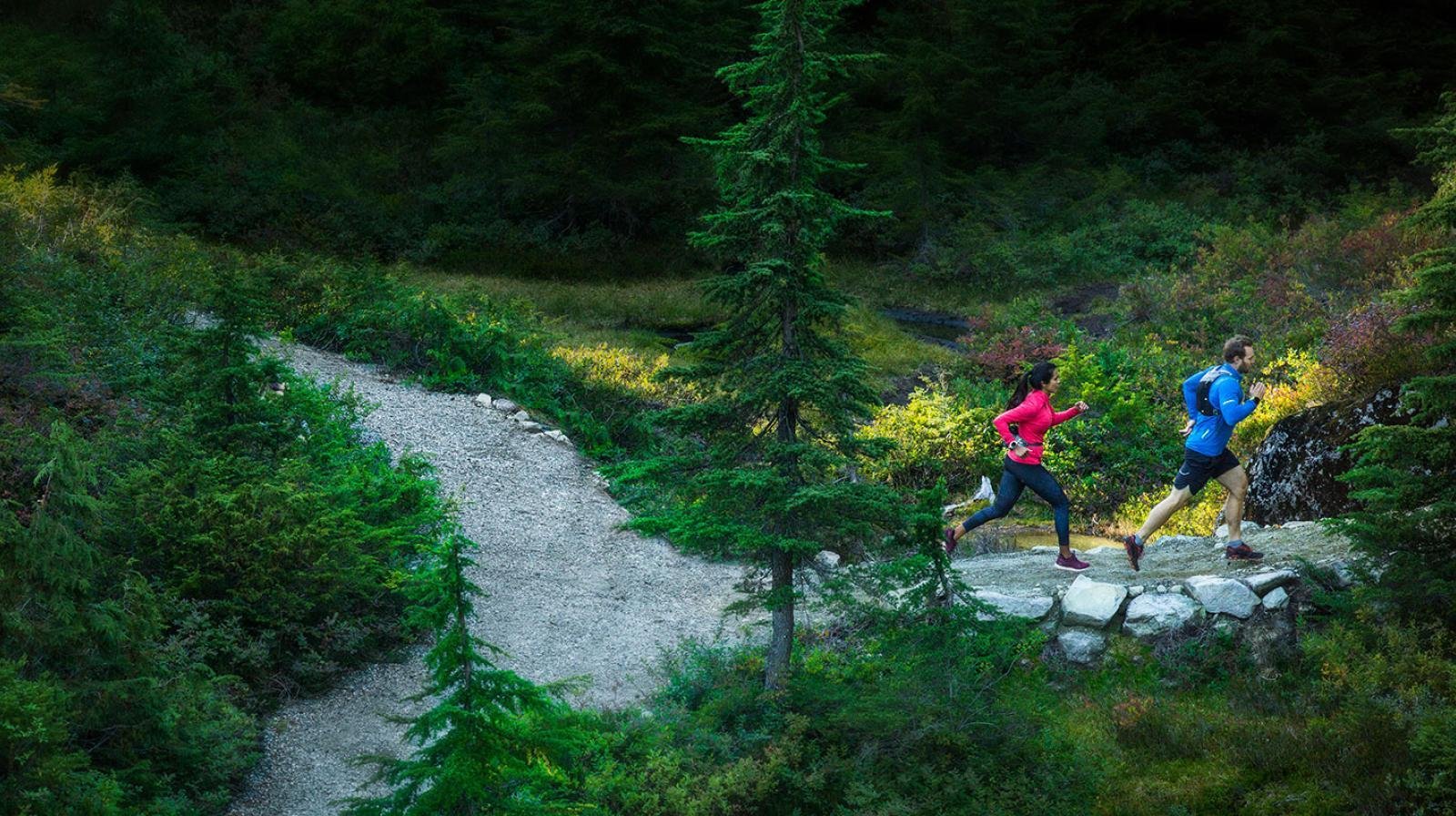 Two outdoor trail runners in the mountains