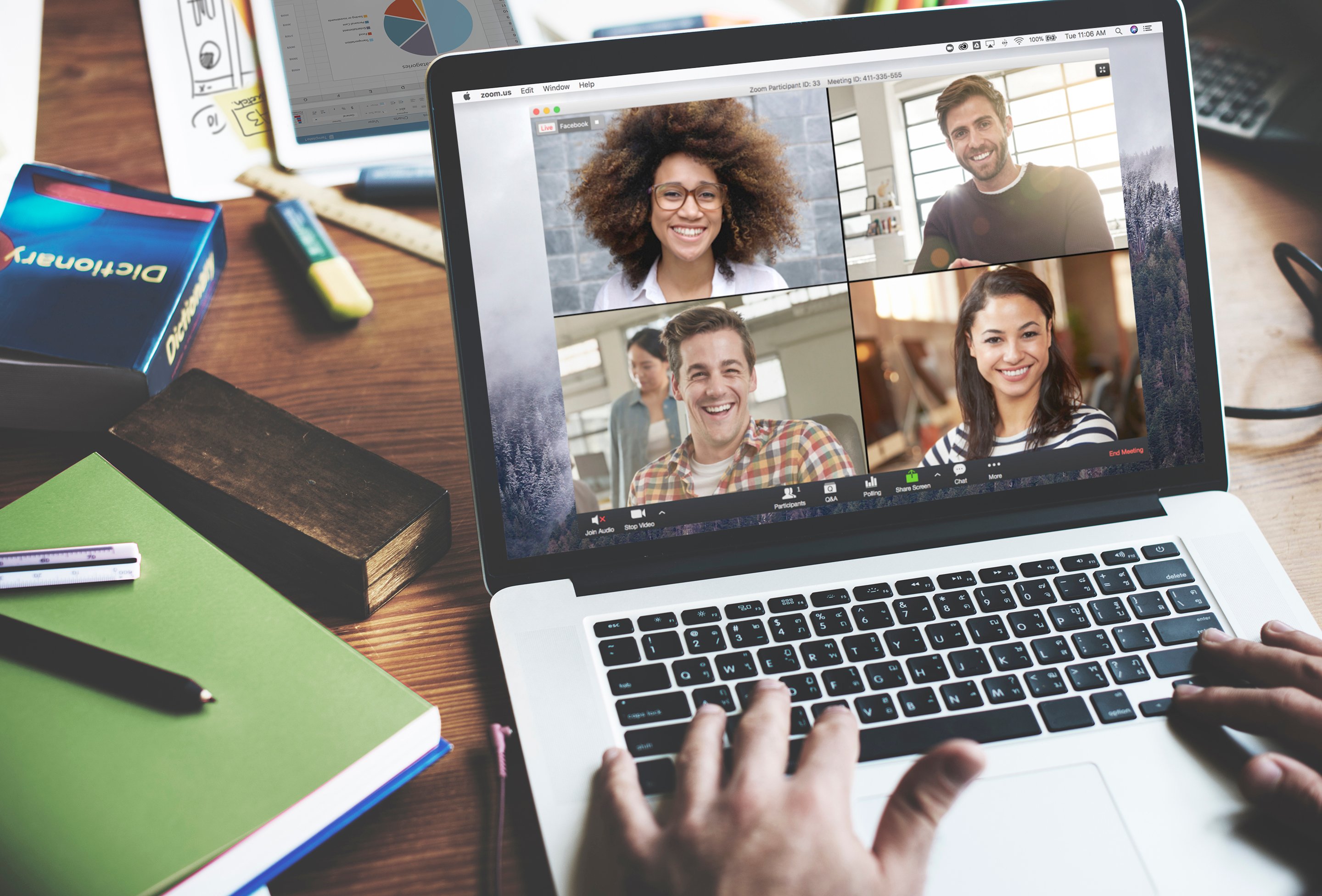 A person participating in a Zoom meeting on a laptop.