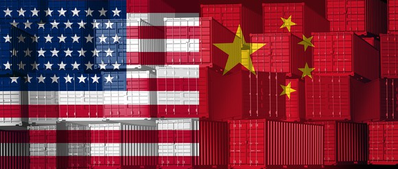 Cargo freight containers painted with the American and Chinese flags.
