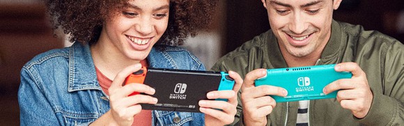 Two adults play a game on their Nintendo Switches.