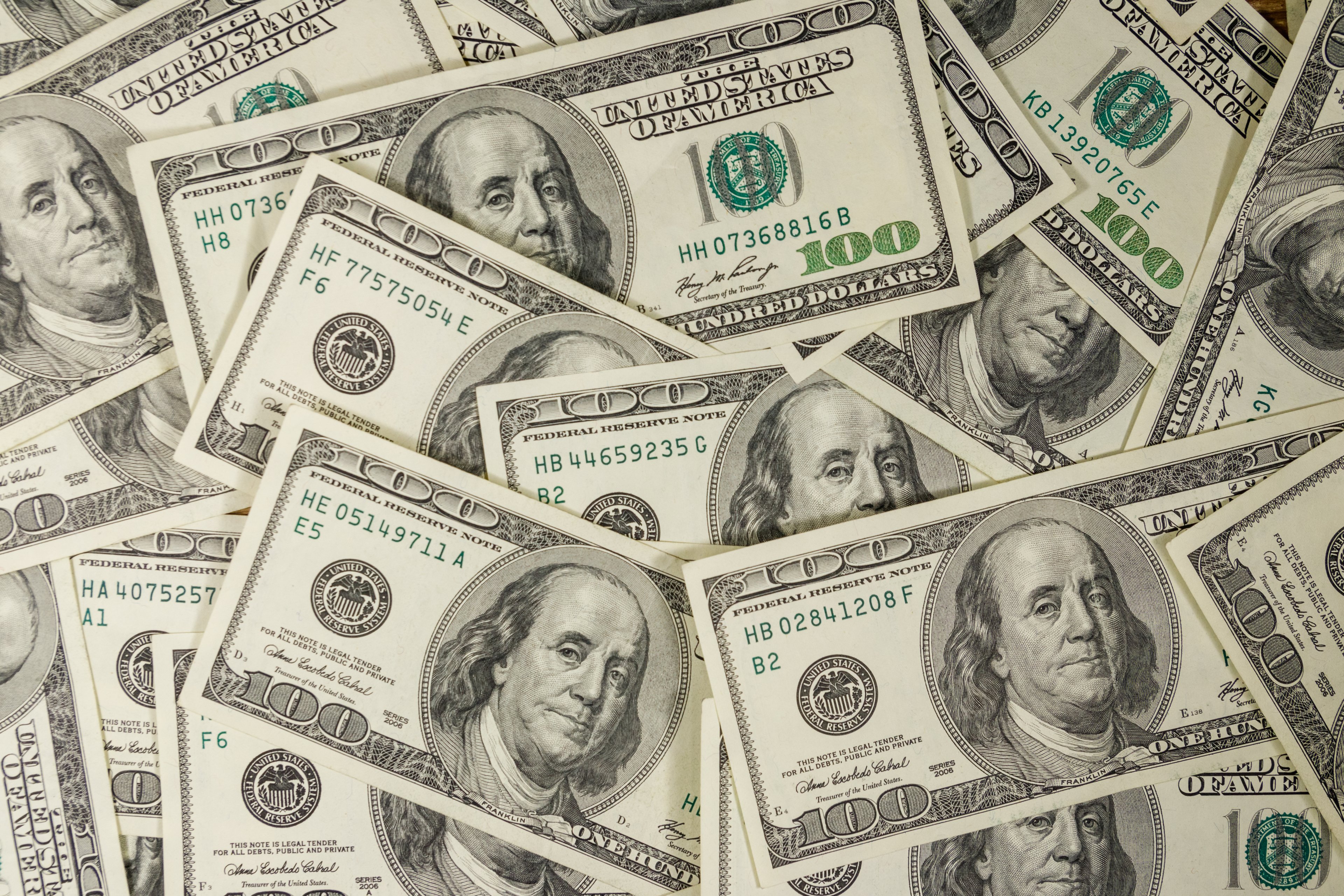 $100 bills in a pile. 