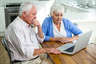 worried seniors at laptop_GettyImages-668025836