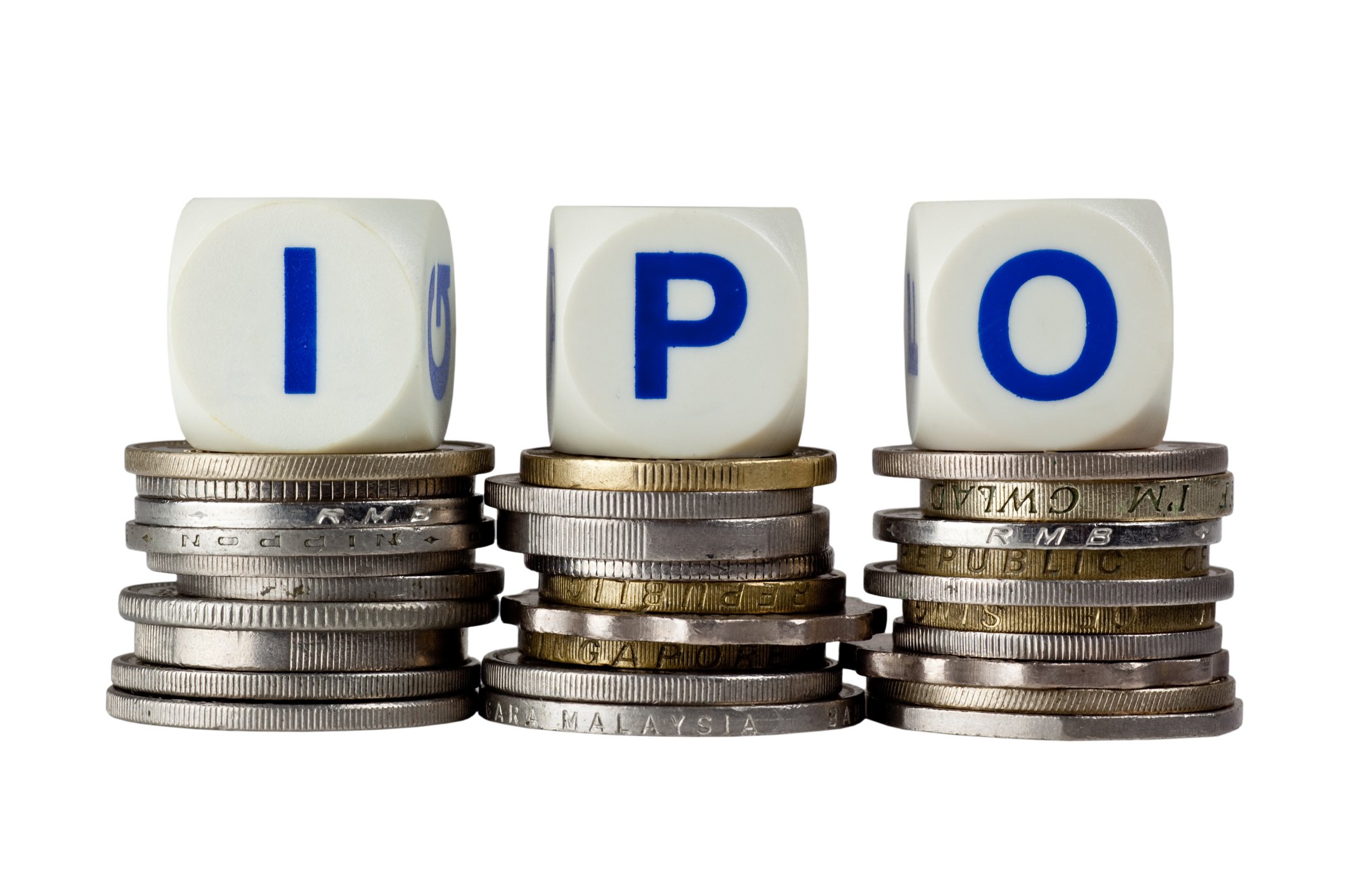 IPO blocks sitting on top of stacks of coins