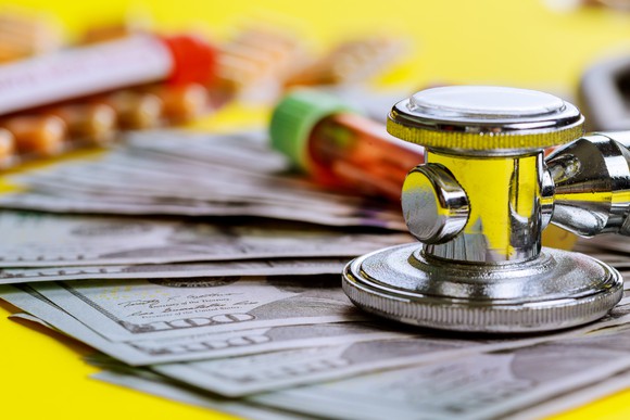 Medicine, a stethoscope, and cash money.