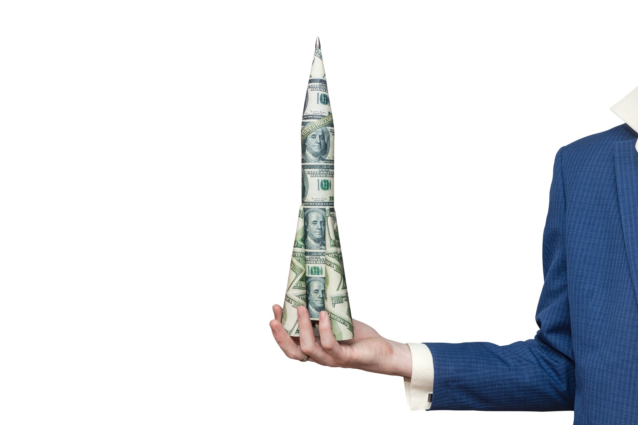 A person holding a small rocket made of $100 bills. 