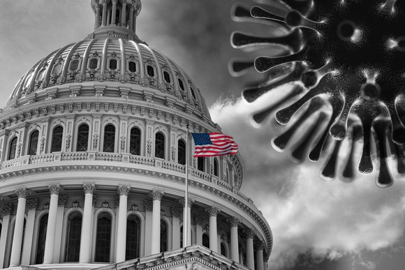 A black-and-white rendering of the U.S. Capitol Building and the coronavirus with an American flag in color flying in front
