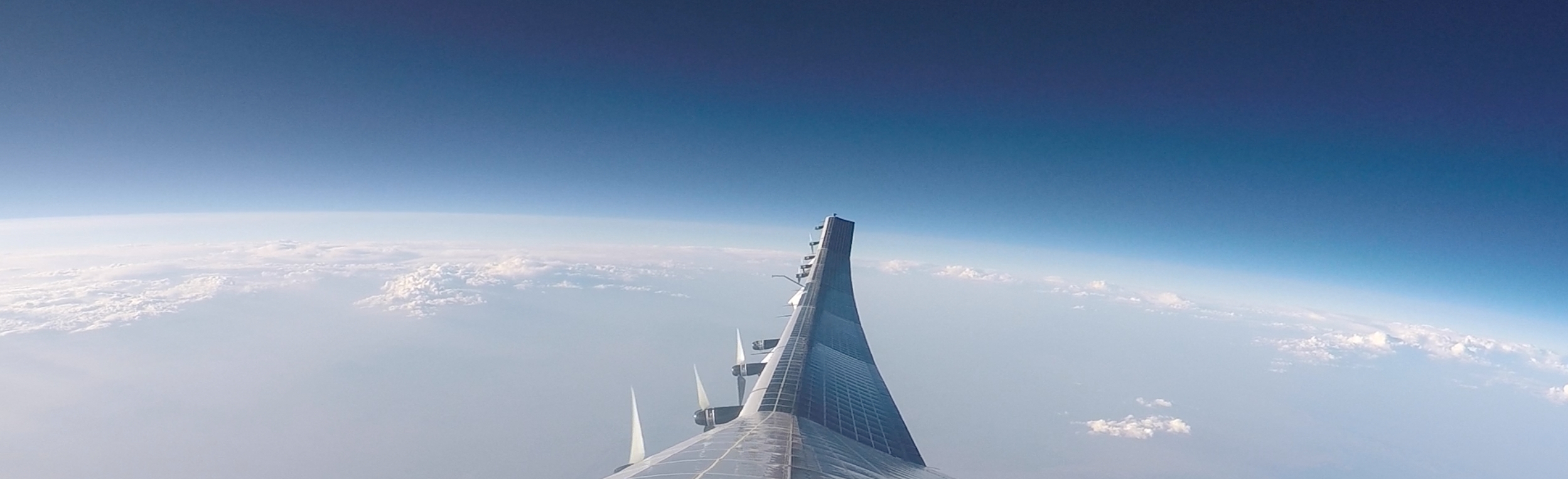Sunglider's right wing viewed over Earth