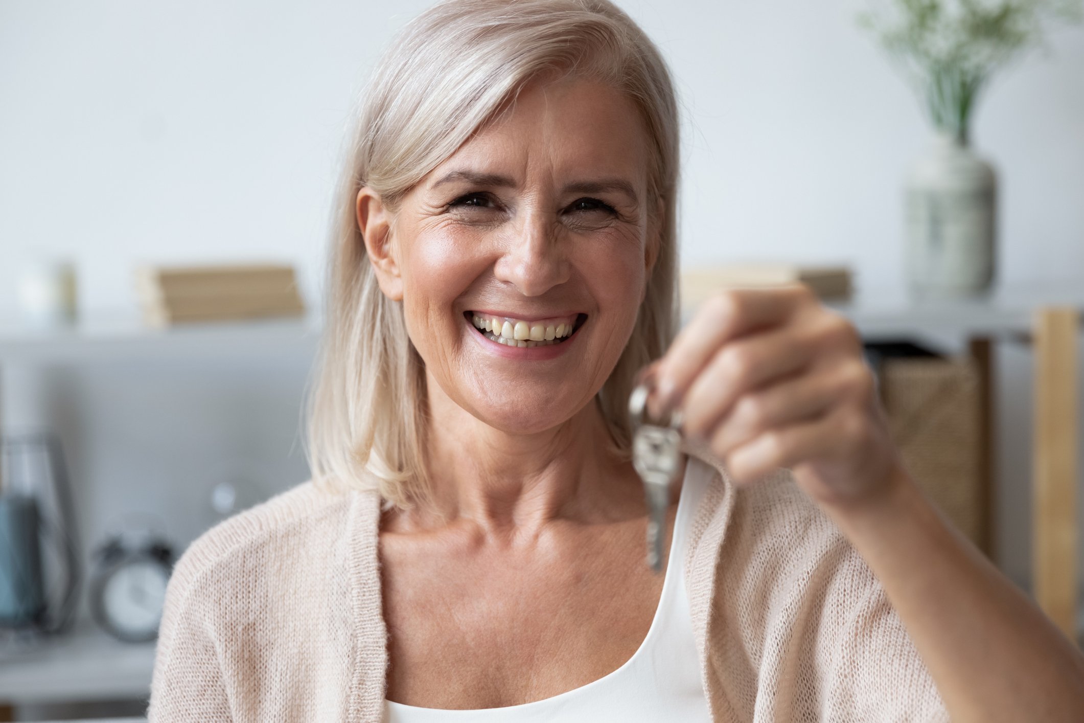 older-woman-holding-key